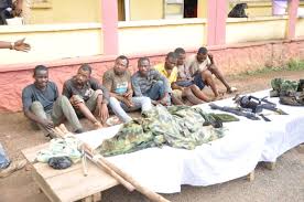 Ghana police arrest five man gang armed robbery led by a military man.